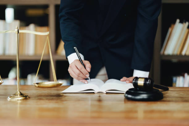 istock Discussing legal matters and signing important documents 1415370700
