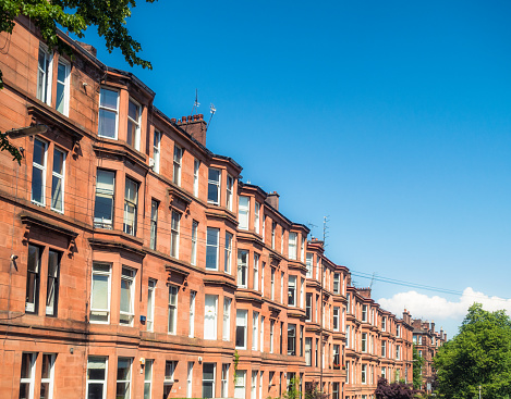 A long row of traditional tenement flats off Clarence Drive in Hyndland, in the West End of Glasgow.
