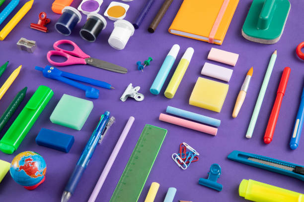 istock School Supplies on Purple Background 1415377474