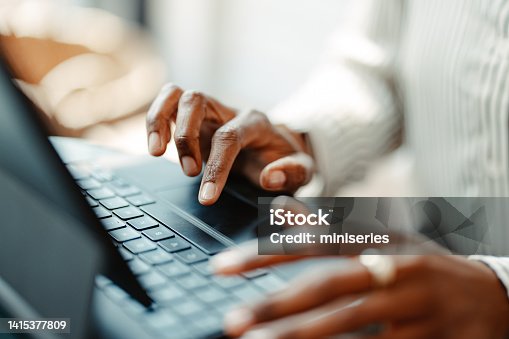 istock Close Up Shot of an Anonymous Woman Typing on a Keyboard 1415377809