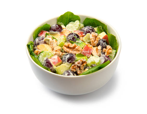 istock Waldorf salad in a white salad bowl isolated on white background. 1415378542