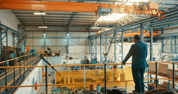Logistics, delivery and shipping warehouse manager with vision thinking, planning innovation and strategy for development and investment funding. Corporate factory owner watching production and staff