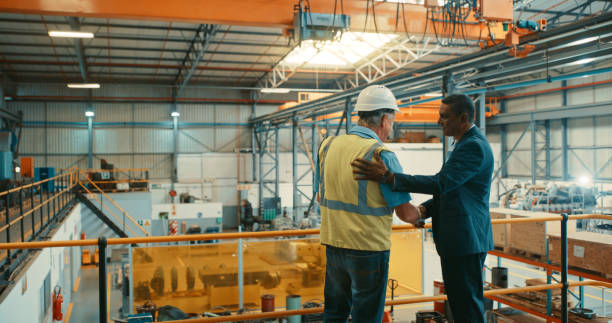 istock Handshake, agreement and success for logistics manager and corporate businessman while greeting, welcoming and promoting. Mature men meeting and agreeing to shipping warehouse funding and export deal 1415382849