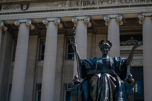 alma mater statue in front of the colombia university library