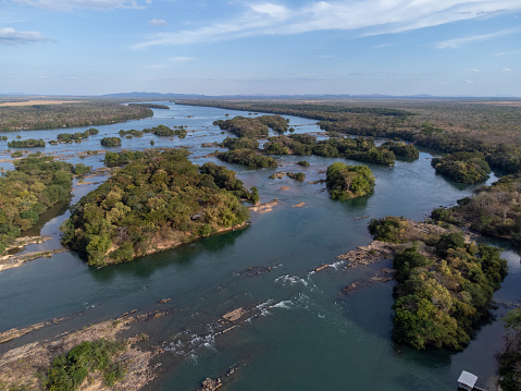 green piece of land with trees on the banks of the great lake of the Tocantins River in Palmas