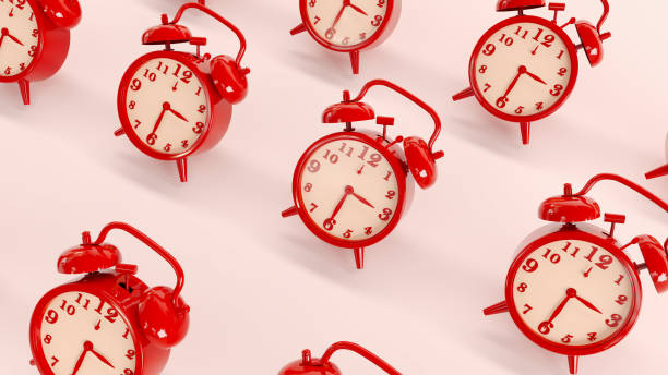 istock red vintage ringing alarm clock on bright white background. 1415385107