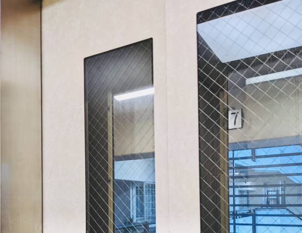 istock Lucky number 7 through the window of the elevator. 1415386440