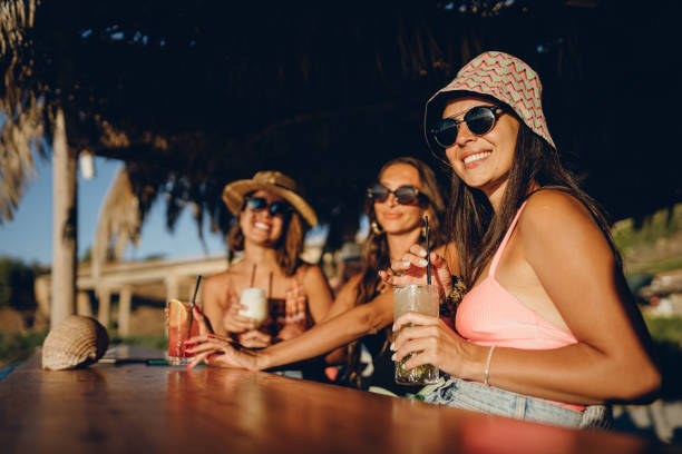 Three friends in a summer bar stock photo