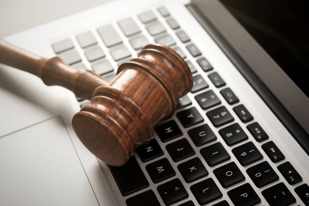istock Cybercrime concept with gavel on laptop 1415387406