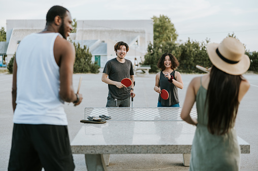 Group of friends enjoying leisure games after work.