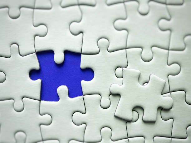 istock Jigsaw puzzle on blue background with customizable space for text or ideas. Copy space 1415388406