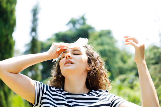 istock Young woman having hot flash and sweating in a warm summer day 1415389120