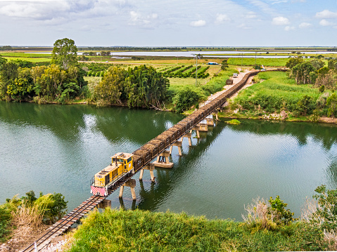 Giru, Australia - Aug 1, 2022: aerial view loaded sugar cane train on 2'6