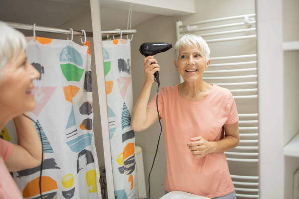 istock Woman drying hair 1415389691