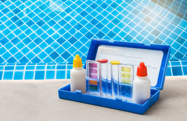 istock Water testing test kit for swimming pool water over blue tile background 1415390030