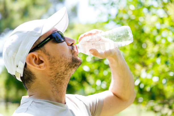 istock Sporty young man drinking water 1415391301