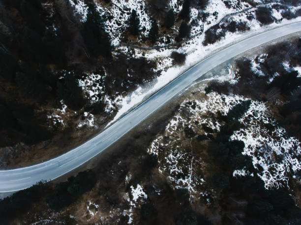 istock Narrow road in mountainous terrain 1415391502