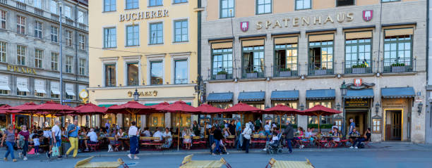 Munich, Germany - August 5, 2013: People dine at the famous Augustiner Beer Hall along Neuhauser Strae during the evening time.