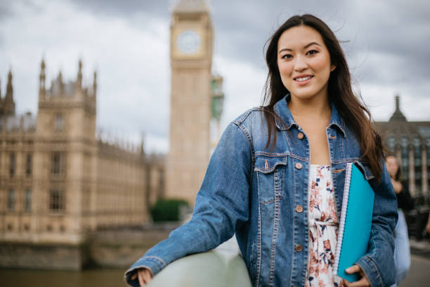 istock Happy Asian female student in London 1415393606