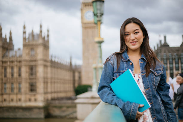 istock Happy Asian female student in London 1415393624