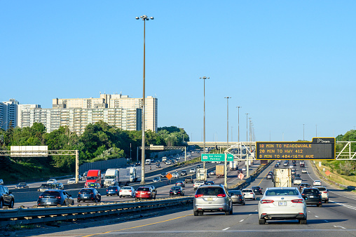 Toronto, Canada - July 22, 2022: A view of the afternoon traffic in the King's Highway 401 which is one of the busiest in the country.
