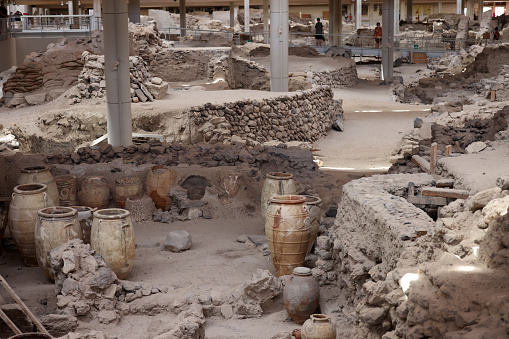 Santorini, Greece - July 01, 2021: Recovered ancient pottery in prehistoric town of Akrotiri, excavation site of a Minoan Bronze Age settlement on the Greek island of Santorini
