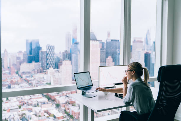 istock Focused woman typing on laptop 1415399570