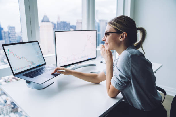 istock Positive woman working on laptop 1415399580