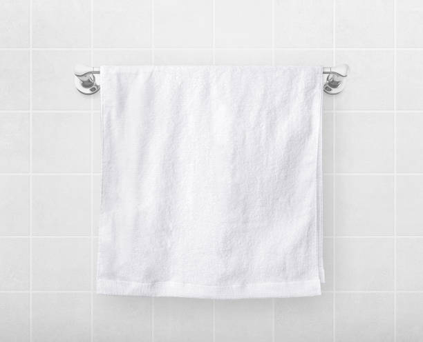 istock White towels hang on a hanger rod. 1415401325