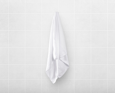 white towels on hanger in toilet bathroom