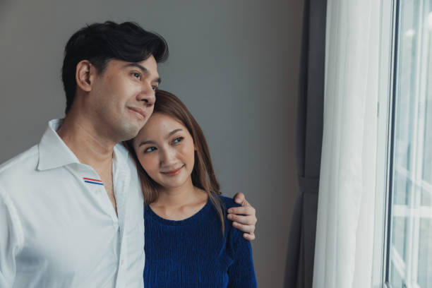 istock Husband embracing wife. 1415401887