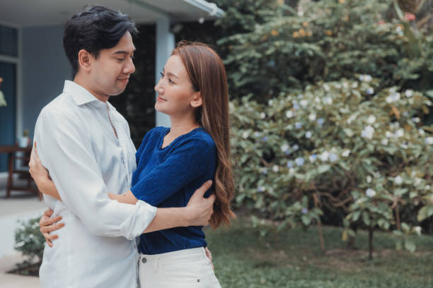 istock Husband embracing wife. 1415402451