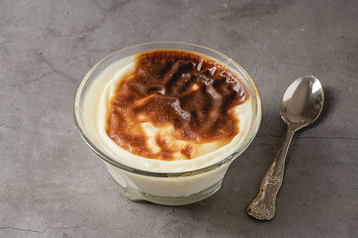 Traditional turkish dessert bakery rice pudding Turkish name Frn Sutlac in glass bowl
