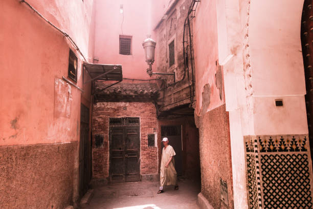 Marrakesh, Morocco - July 25th 2018 : a man walking in the streets of old medina