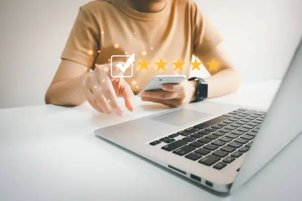 Photo of Customer satisfaction assessment rating 5 stars by laptop, User has received excellent service, Review the highest rated service, the best attention, impressed very good service, feedback from guest.