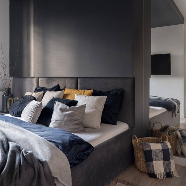 istock Stylish bedroom with big bed and mirror 1415403940
