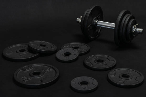 istock Weight training dumbbell kit with some cast iron weight plates 1415404479