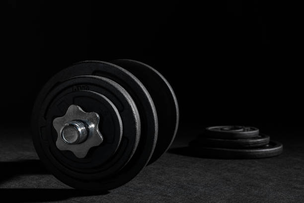 Weight training dumbbell kit with some cast iron weight plates