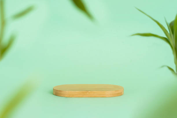 istock Podium or platform made of bamboo and blurred bamboo leaves 1415404527