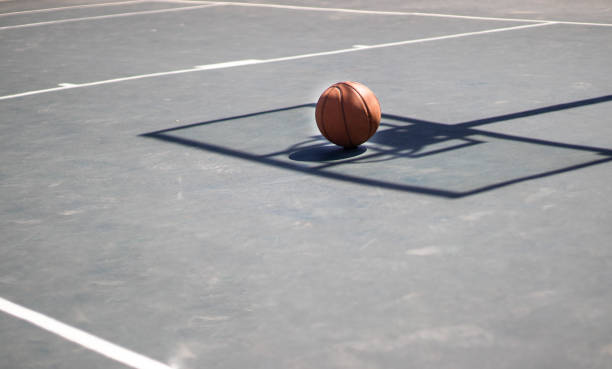 istock A basketball with a shadow of a hoop 1415405701