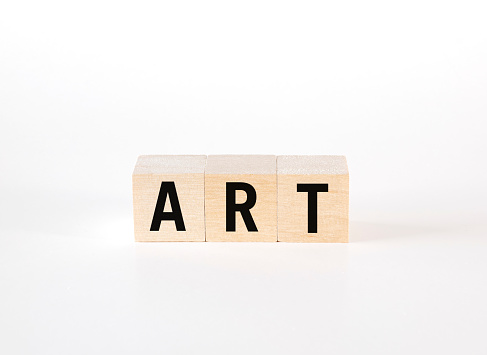 Cubes on white background forming the word “Art”