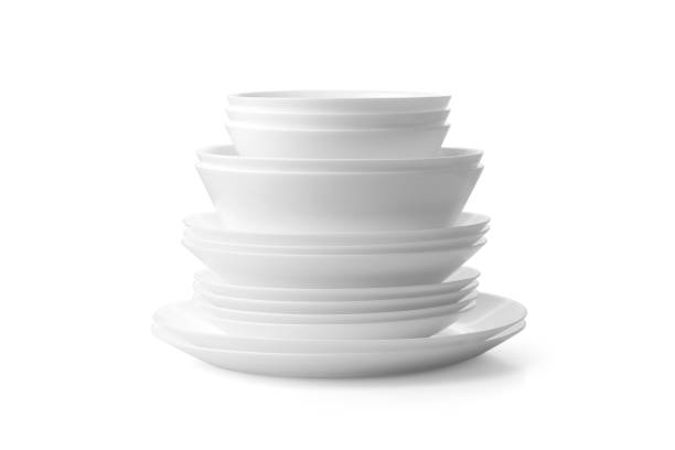 istock Plates and bowls stacked on a white background 1415406974