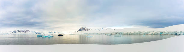 Antarctic iceberg landscape at Portal Point which is located at the entrance to Charlotte Bay on the Reclus Peninsula, on the west coast of Graham Land. stock photo