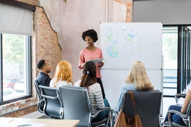 istock Diverse employees hold brainstorming session in conference room 1415407850