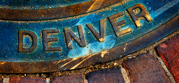Denver plate or seal on man hole manhole cover or iron metal sign