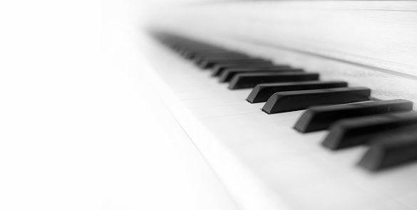 Bright White Piano Keys on Old Piano Close up High Toned