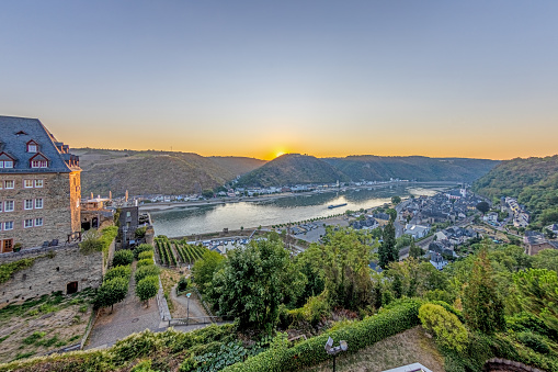 Drone panorama over St. Goar and St. Goarshausen during sunrise in summer