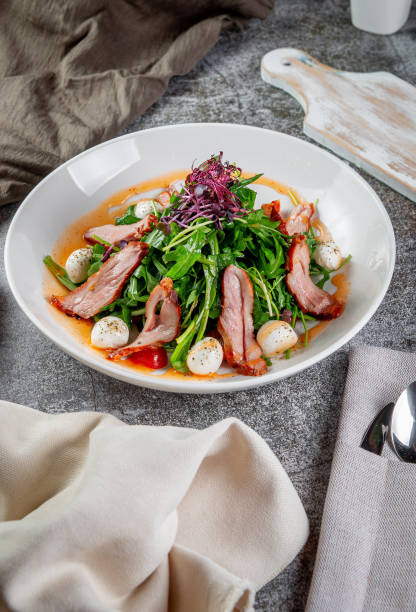 istock Smoked duck breast salad with vegetables and spices 1415410049