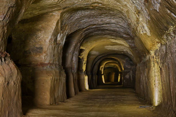 air raid shelter of world war ii, old tunnel dug into the tufa rock where people took refuge during the bombings - air raid imagens e fotografias de stock