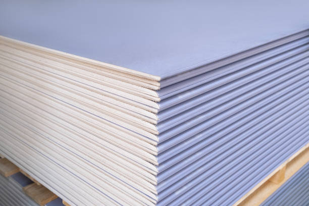 The stack of Special gypsum board with enhanced sound insulation Plasterboard. Panel Type DF for indoor concrete walls prepared for construction